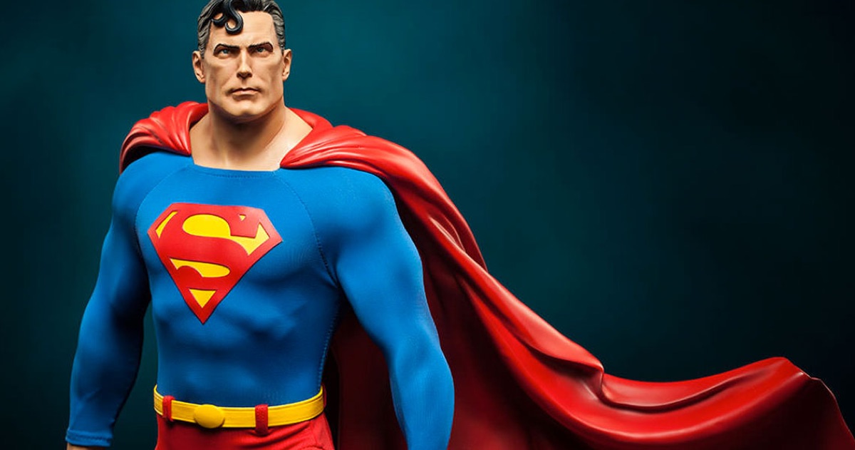 A Superman collectible statue in cape and full colour, lit against a dark teal background