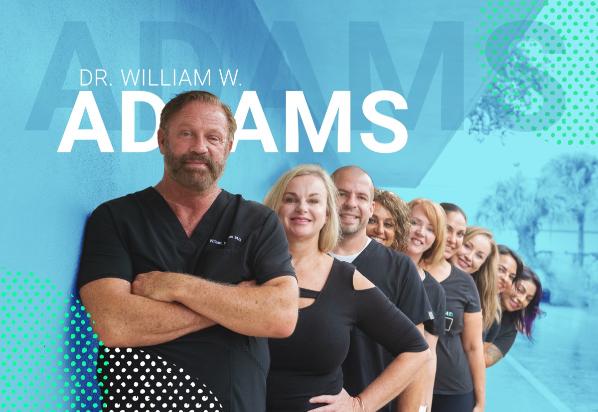 A teal graphic for Dr. William W. Adams, the doctor in front of his team in matching scrubs
